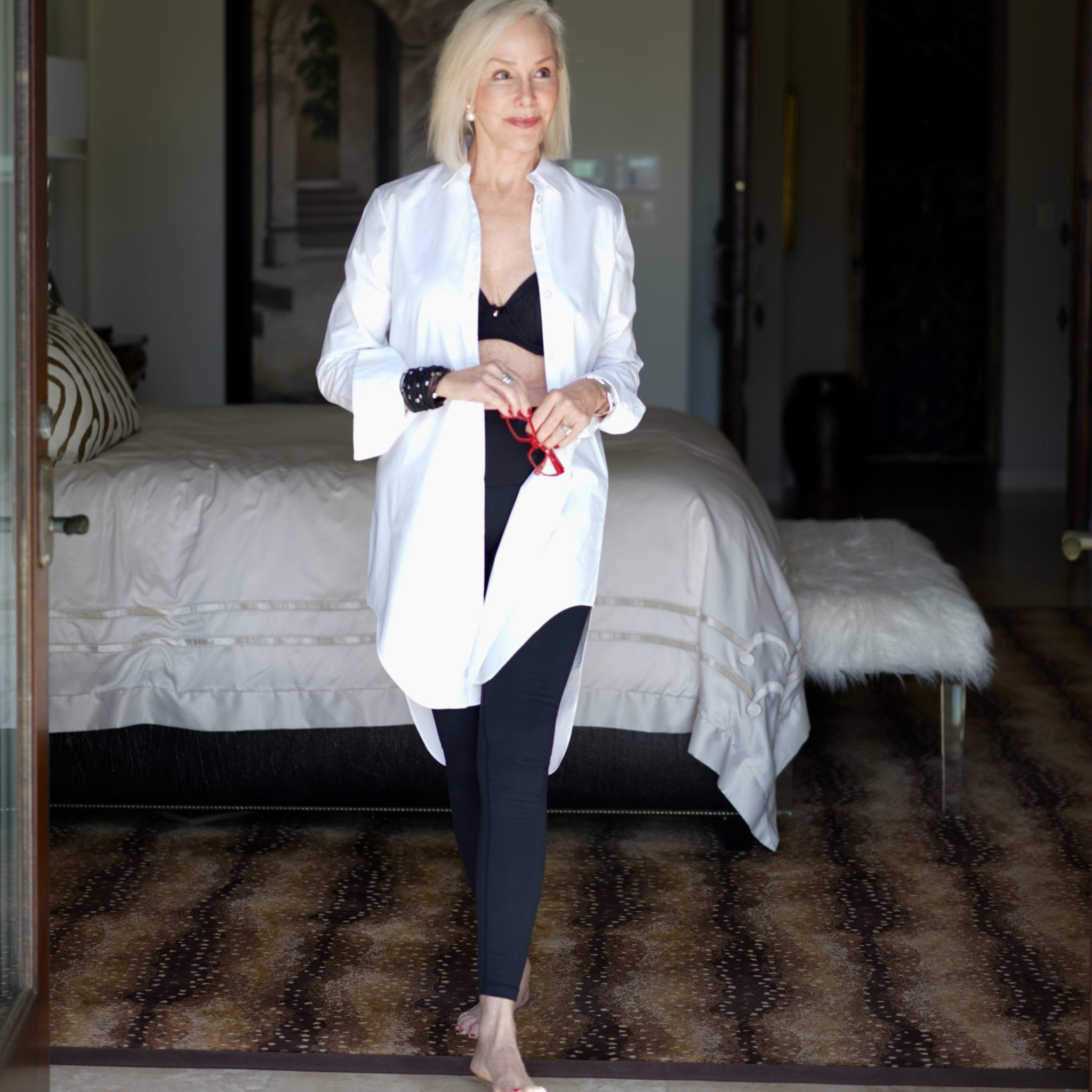 Long white shirt over black bra by Soma Intimates & black leggings in master bedroom