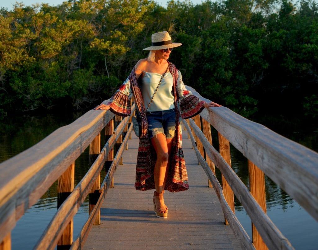 blue camisole, denim shorts with boho kimono, and hat with espadrilles