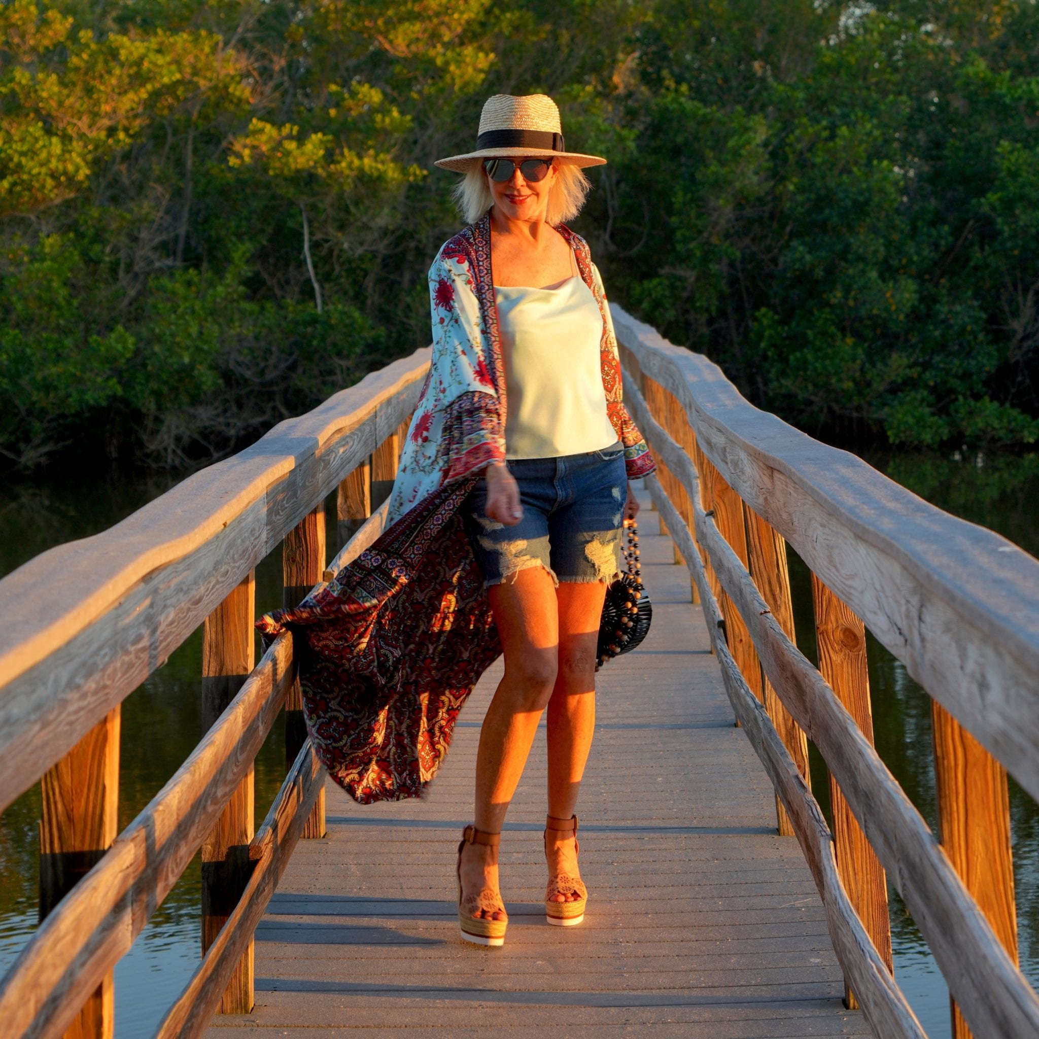 blue camisole, denim shorts wit hat with espadrilles