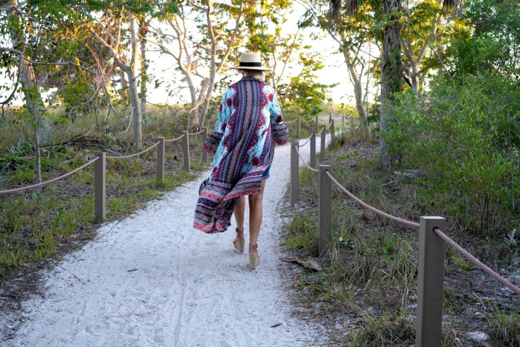 blue camisole, denim shorts with boho kimono, and hat with espadrilles