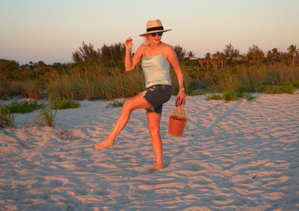 blue camisole, denim shorts wit hat with espadrilles