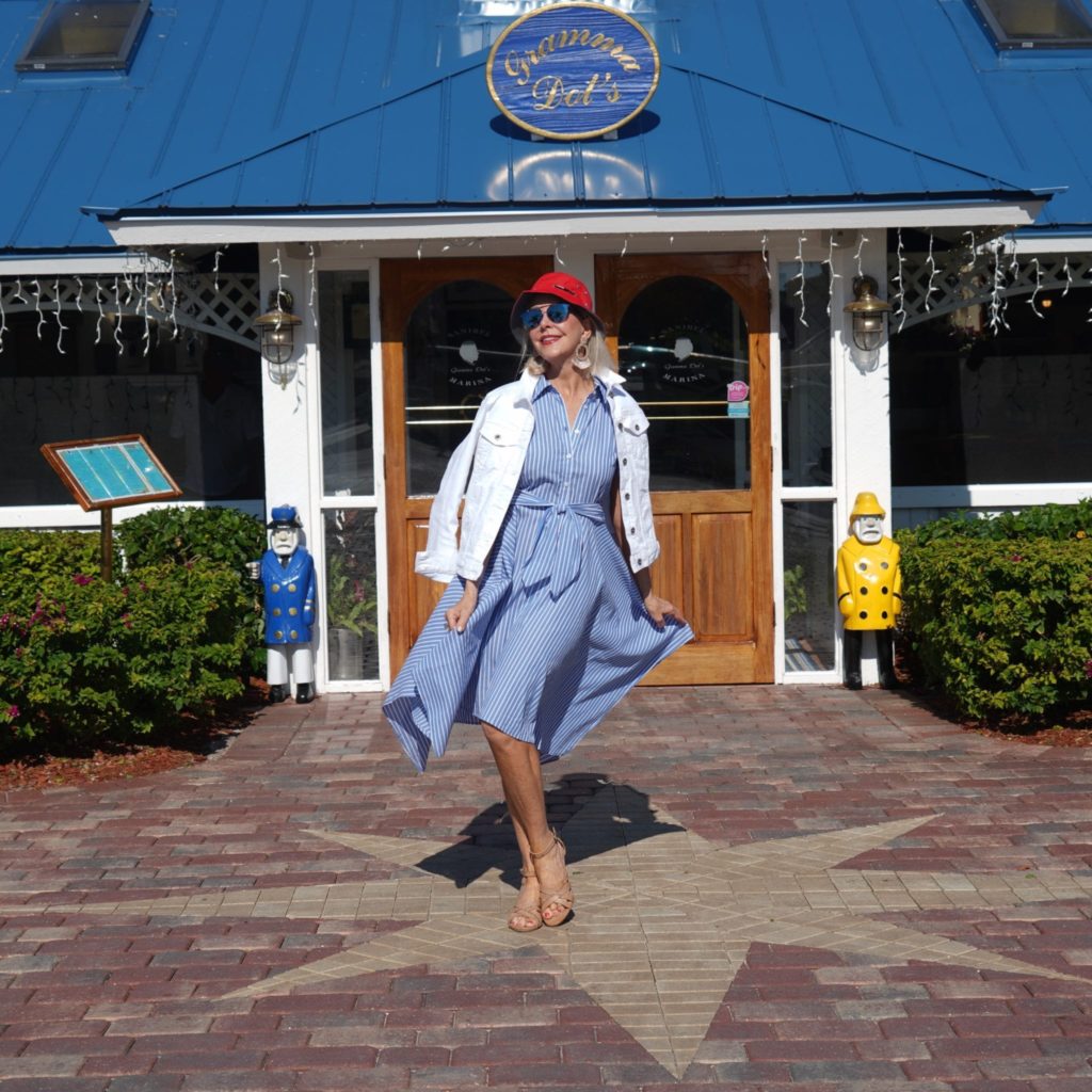 Blue & white stripe dress, red sailor hat, white denim jacket, neutral wedge sandal