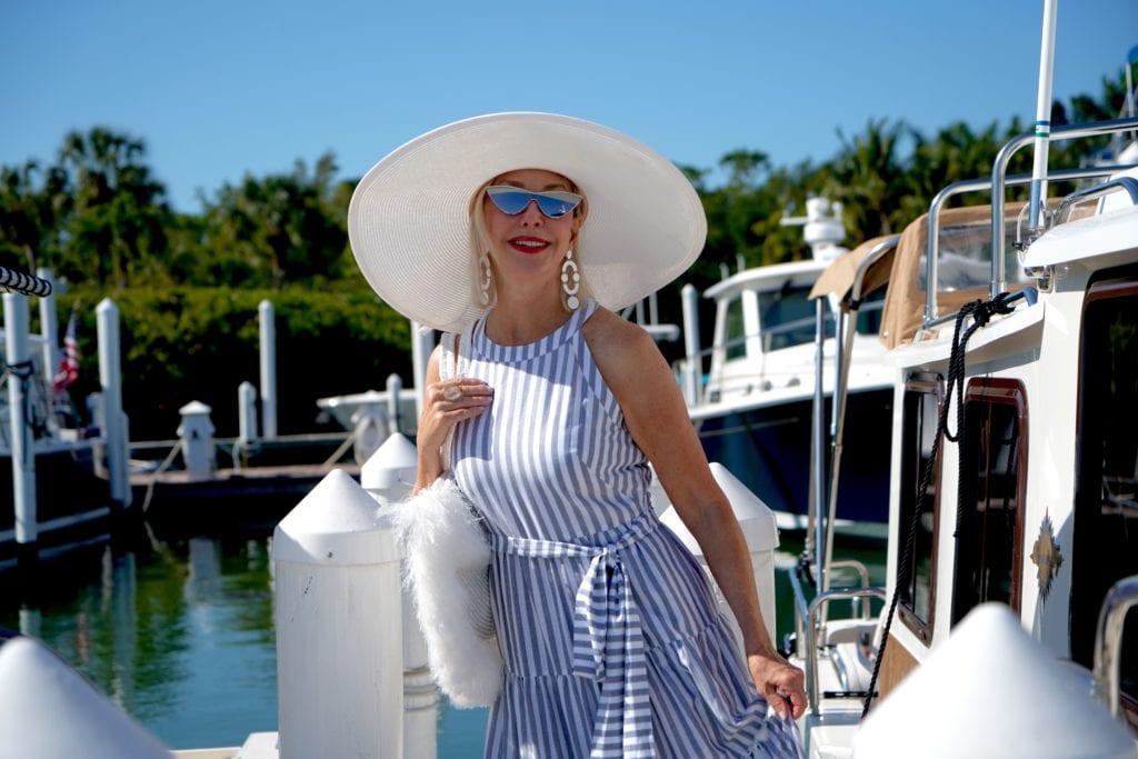 summer maxi dress, marina, boardwalk, big white hat. white yacht, large white tote bag
