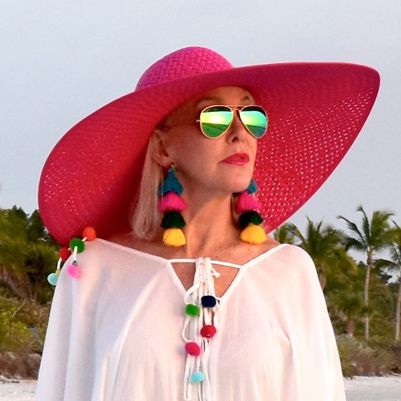 large wide brimmed hot pink hat with swimsuit coverup