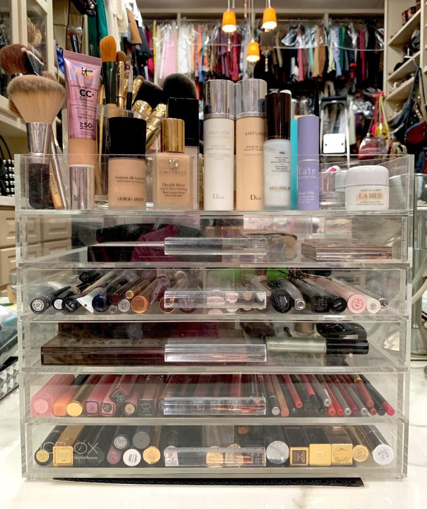 acrylic makeup storage with assorted makeup,