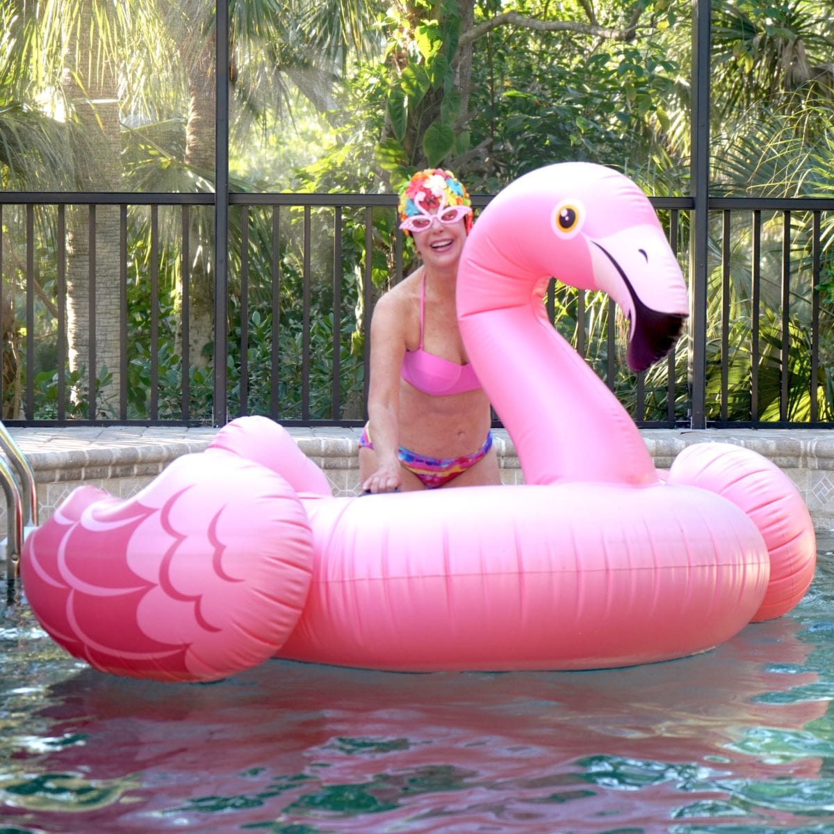 Sheree of the SheShe Show on Flamingo pool float
