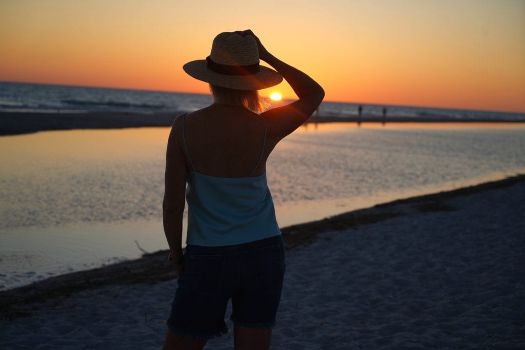 Sheree Frede lat the beach looking at sunset