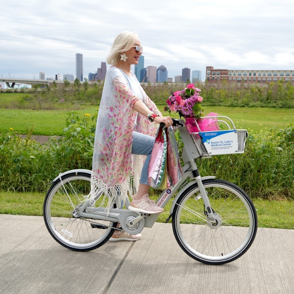 Sheree Frede of the SheSheShow riding bicycle