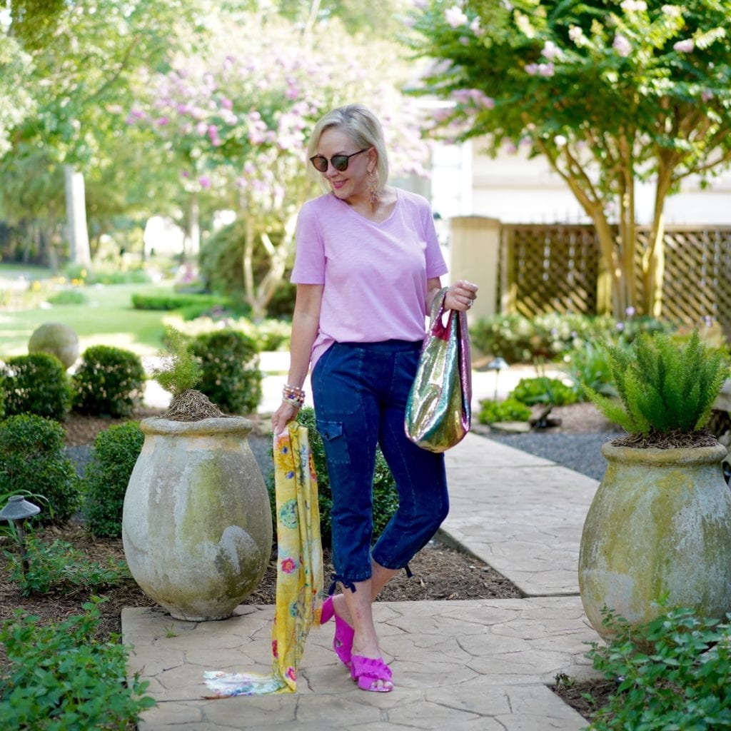 Sheree of the SheShe Show wearing llilac t-shirt and denim utility crop jogger