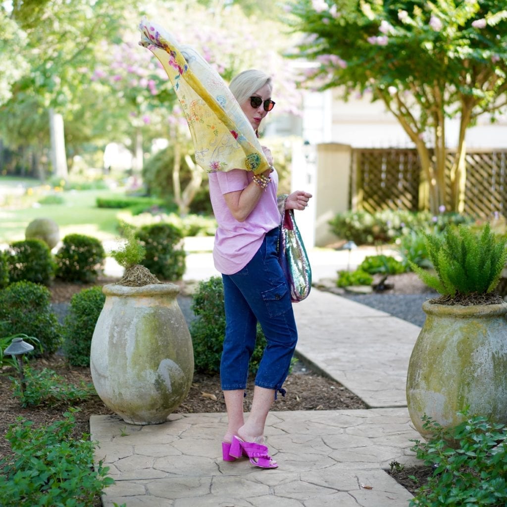 Sheree of the SheShe Show wearing llilac t-shirt and denim utility crop jogger