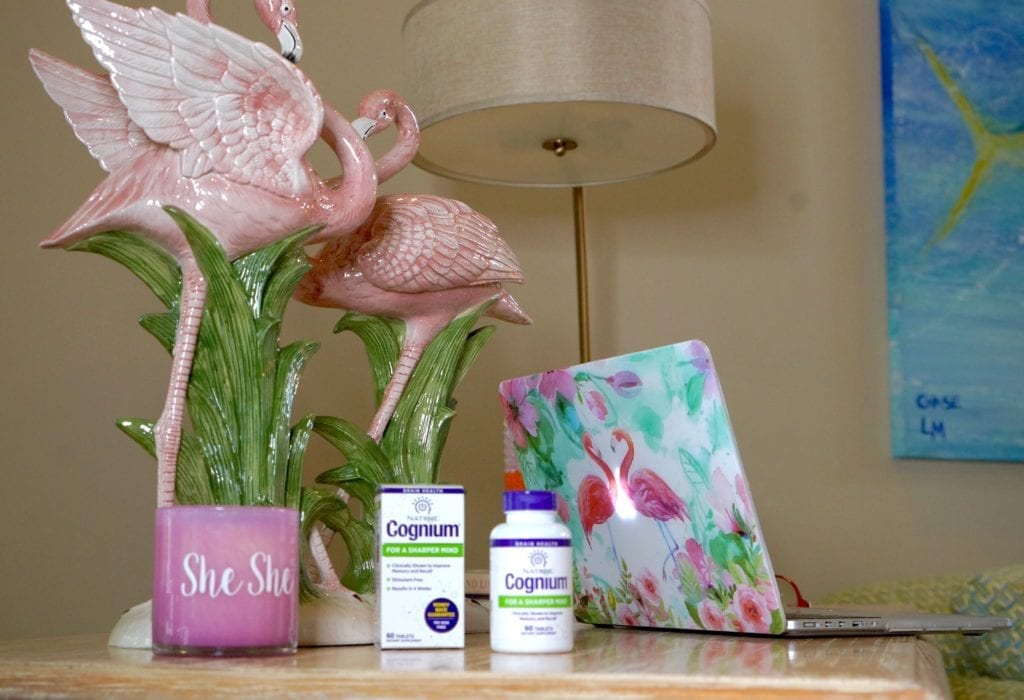 Natrol Cognium product sitting on a desk with a computer