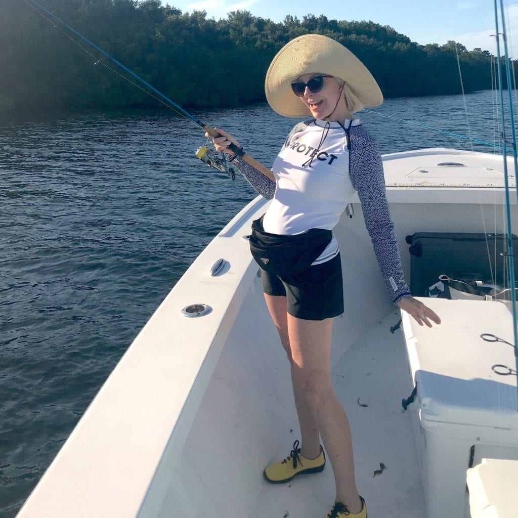 Sheree Frede of the SheShe Show fishing on a boat