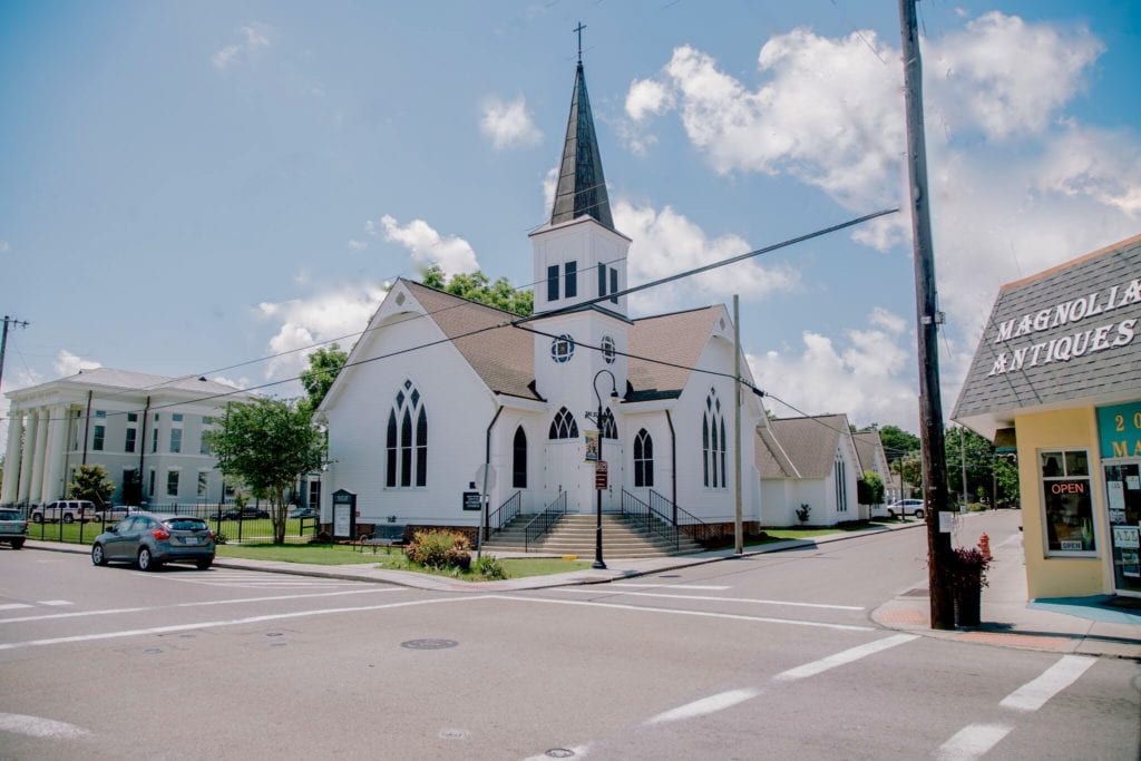 old whit church with steeple