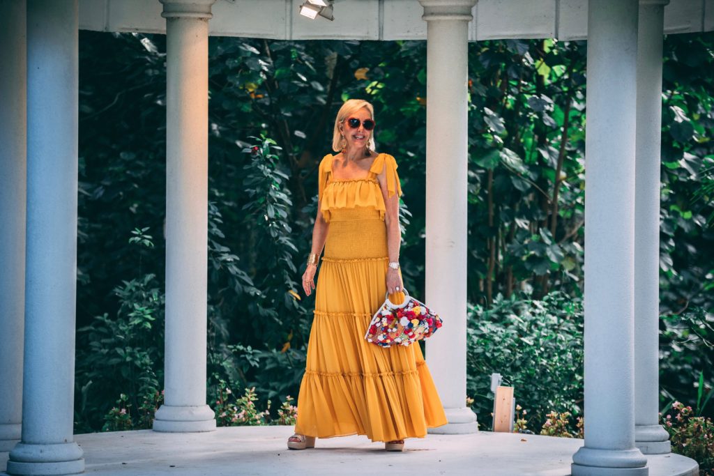 Sheree of the SheShe Show wearing a yellow maxi dress