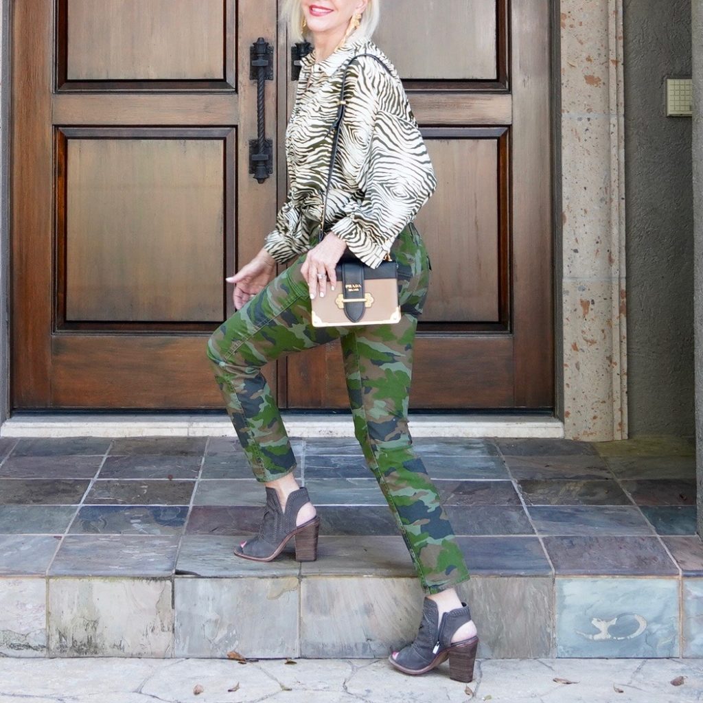 SheShe of the SheShe Show wearing camo pants and zebra top.