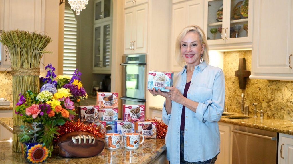 Sheree of the SheShe Show holding Betty Crocker Mug Treat box