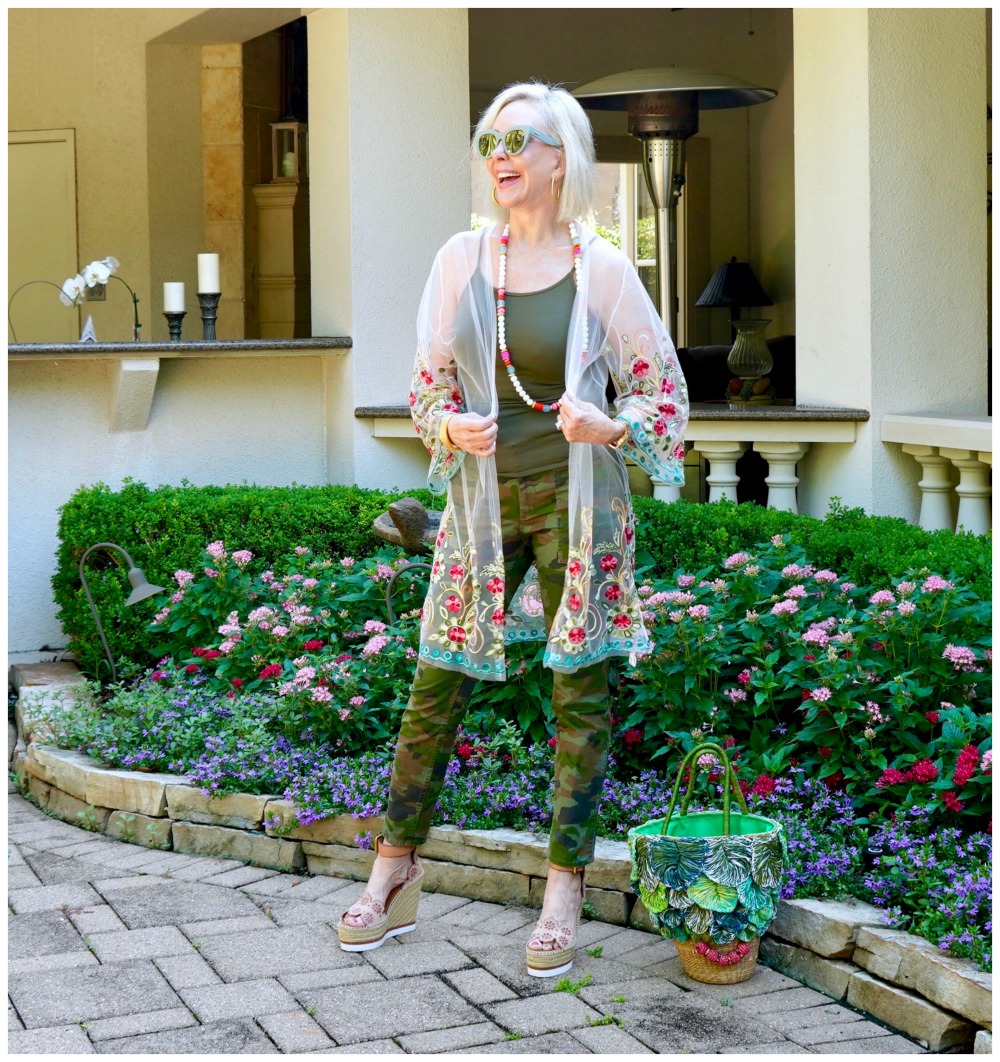 Sheree Frede of he SheShe Show wering camo pants with sheer floral kimono