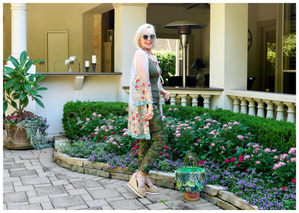 Sheree Frede of he SheShe Show wering camo pants with sheer floral kimono