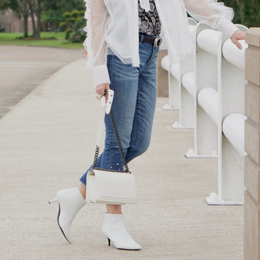 white patton kitten heel booties worn with jeans and white top