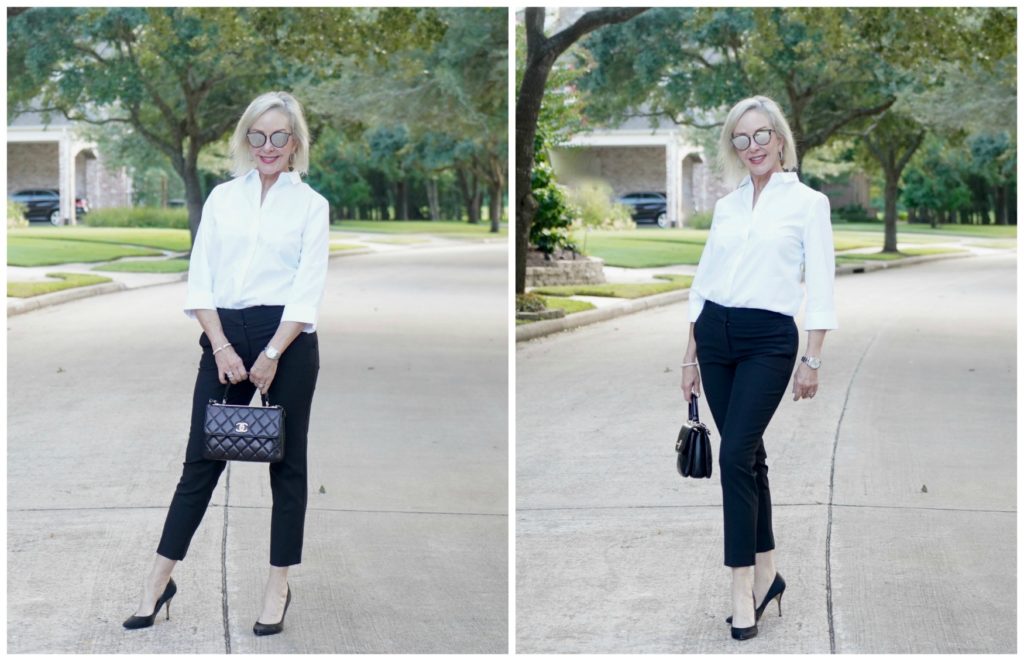 Sheree of the SheShe Show wearing basic black pants and white shirt with black pumps and Chanel bag