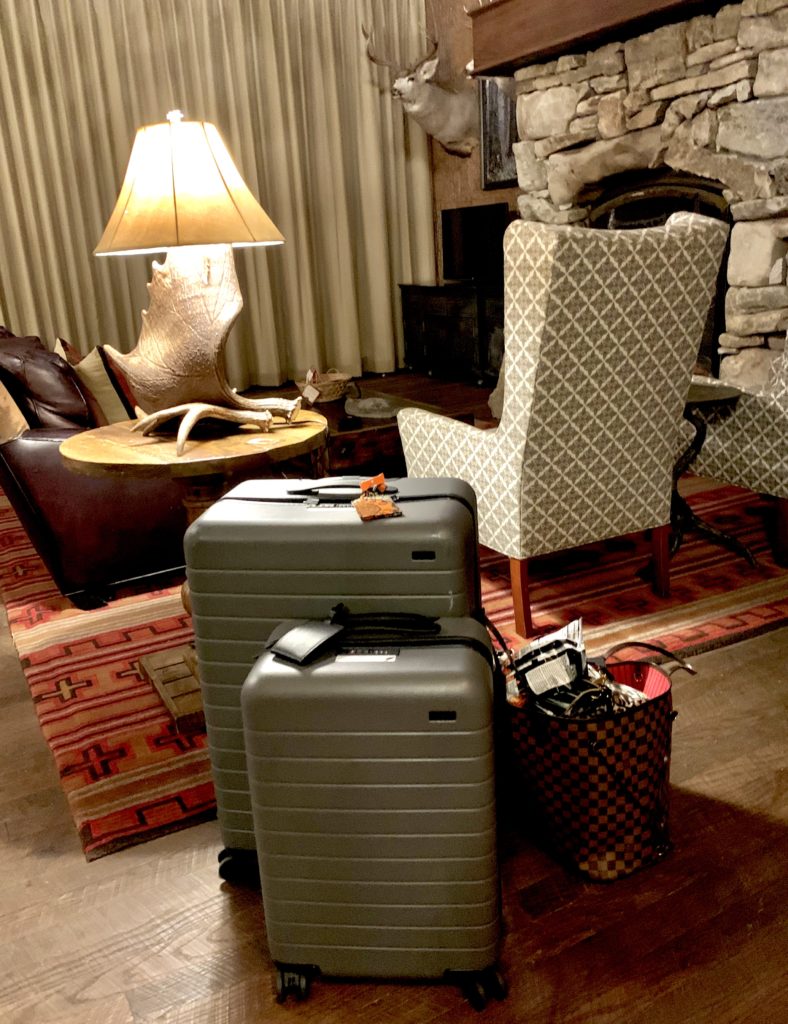 2 Suitcases sitting in hotel room