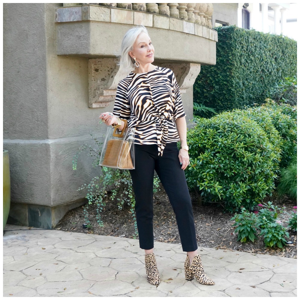 SheShe of the SheShe Show wearing a zebra top over black pants