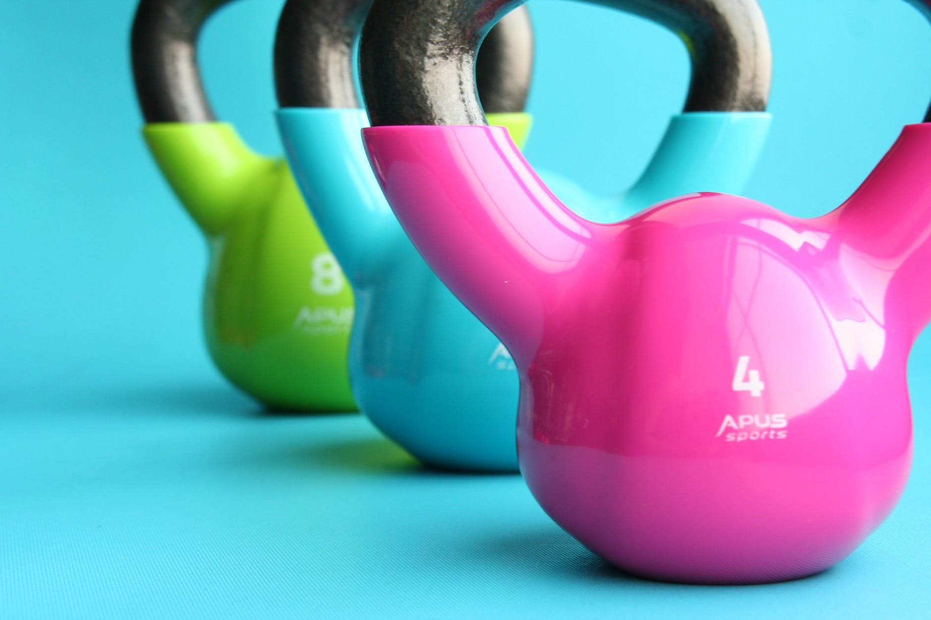 pink, bule and green kettle ball for workouts