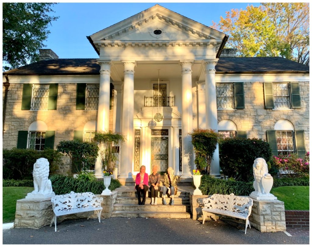 SheShe, Shauna, and Jamie sitting in front of Graceland Mansion in Memphis, Tennessee