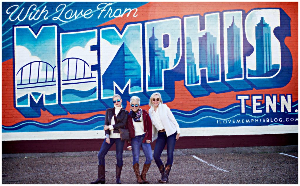 Jamie, Shauna, and Sheree Frede of the SheShe SHow standing in front of Memphis wall mural