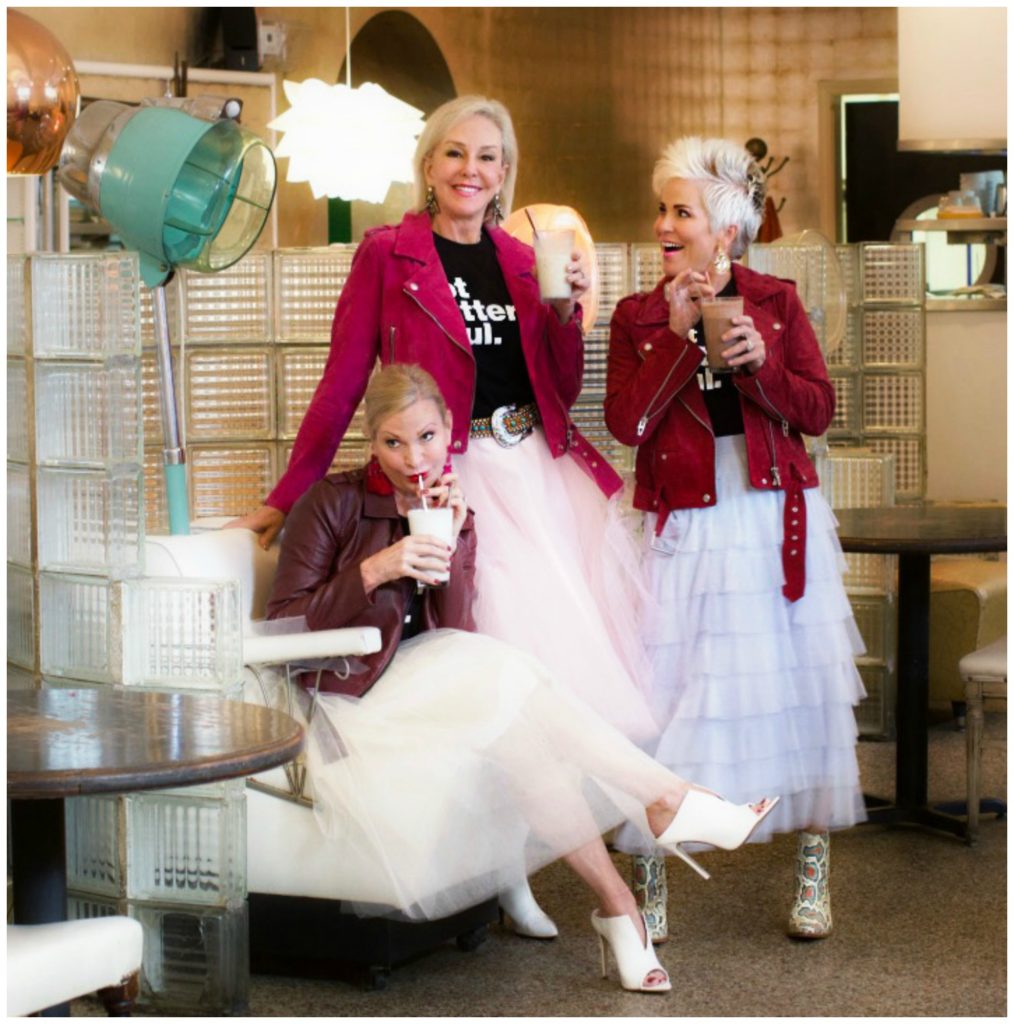 Jamie, SheShe and Shauna wearing pink and tan toole skirts with jackets sipping shakes at the Beauty Shop Memphis, TN.