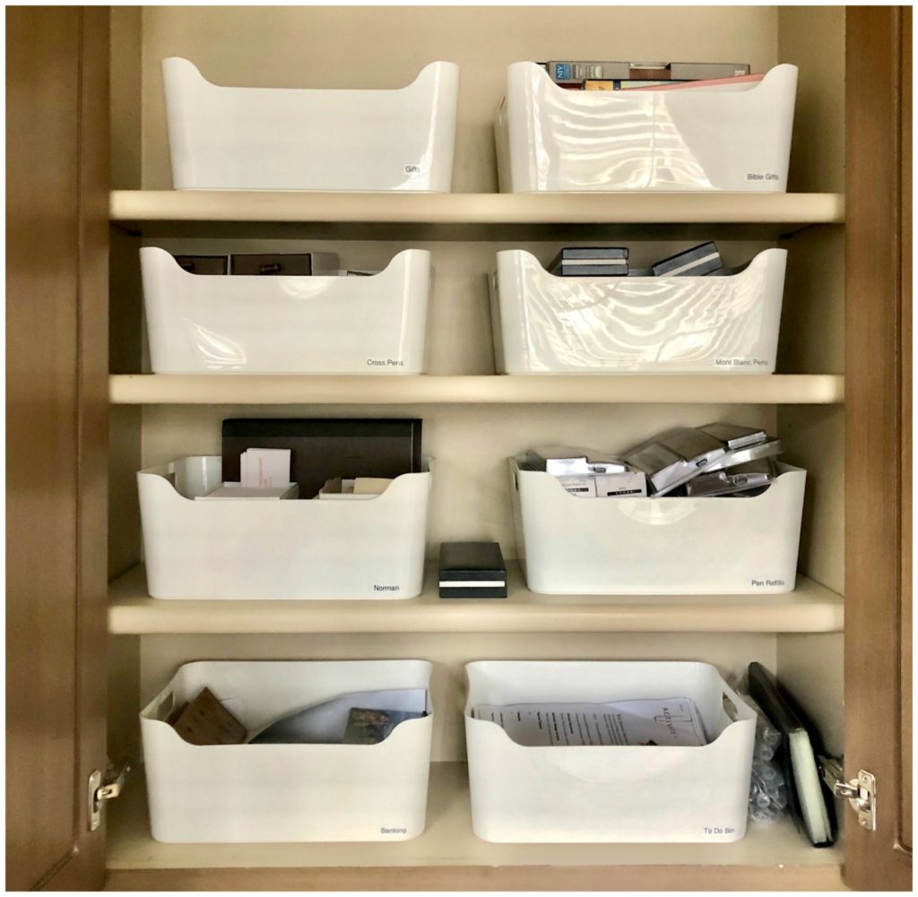 upper cabinet with 8 white storage containers
