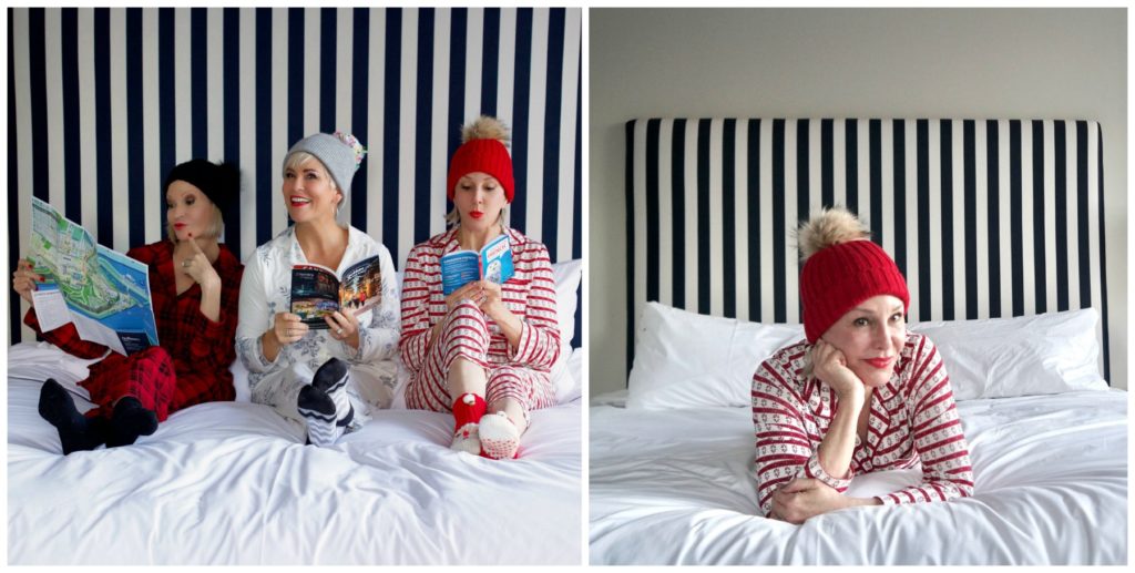 Jamie, Shawna, and Sheree wearing Christmas jammies siting on the bed.