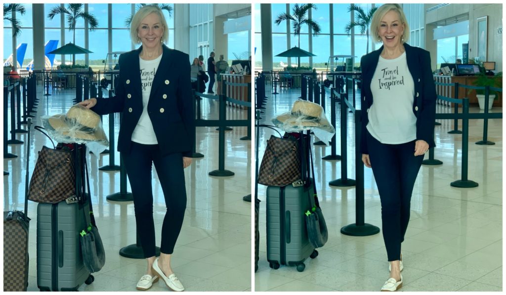 Sheree of the SheSheShowin the airport wearing blue jeans and navy double breasted blazer