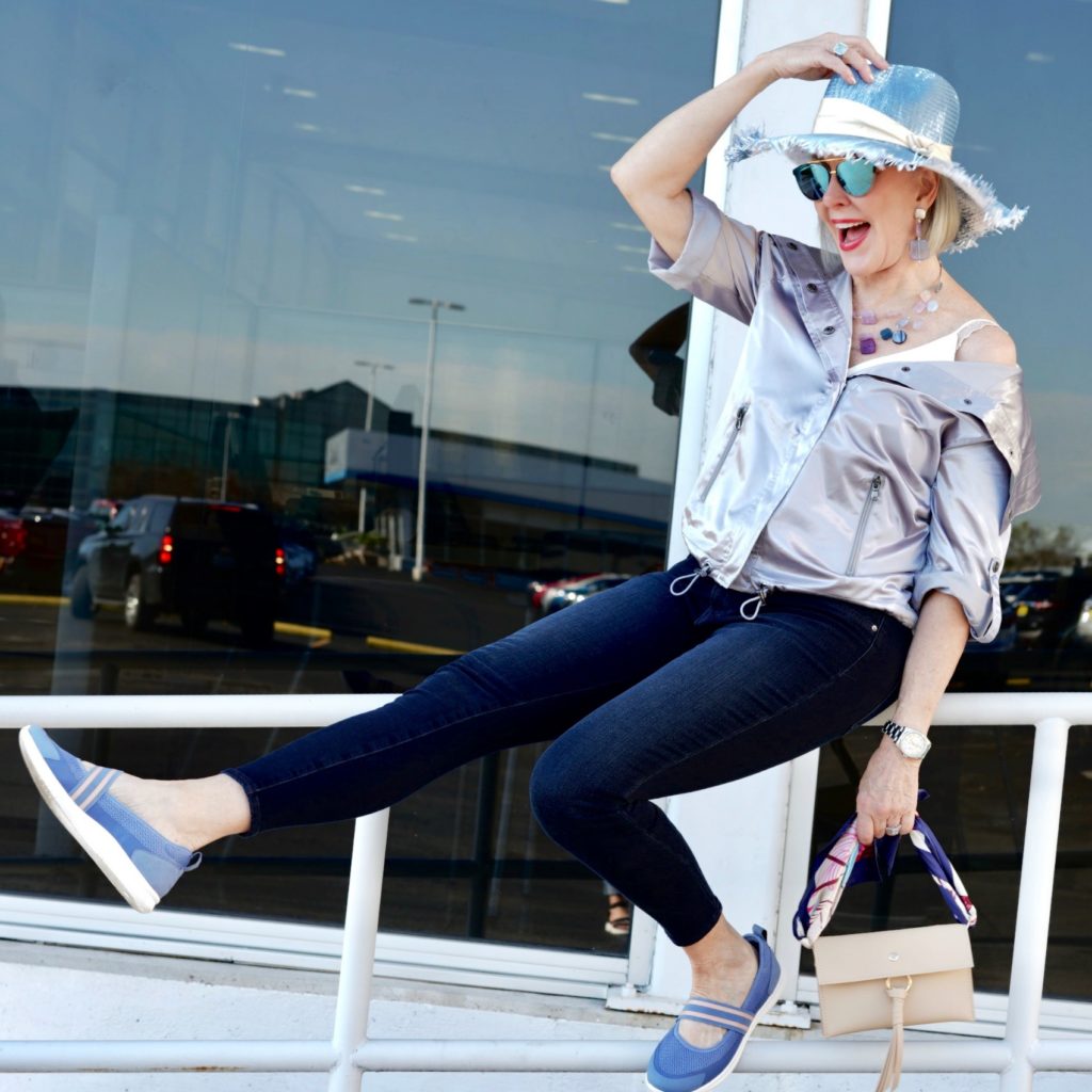 sheree frede wearing silver jacket, blue hat, jeans and easy spirit shoes