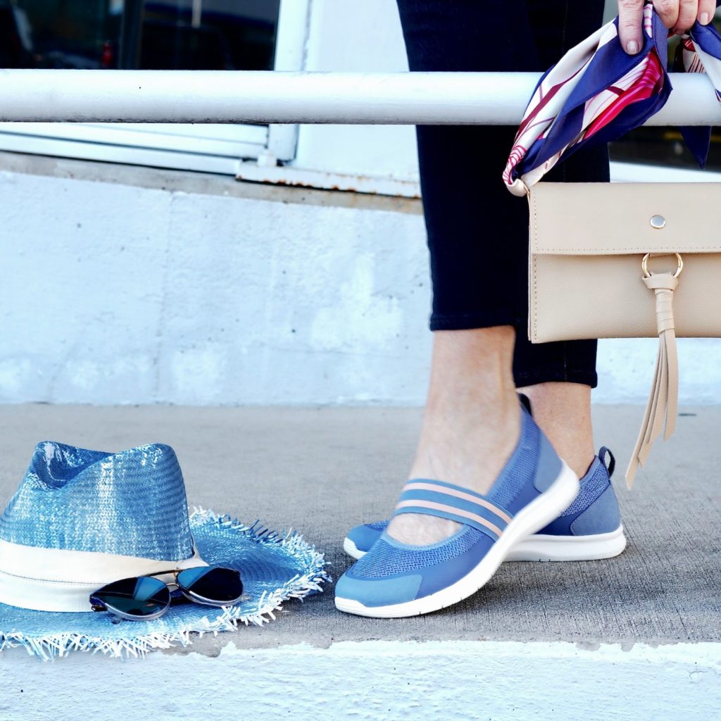 Image of blue easy spirit shoes with sun hat and sunglasses