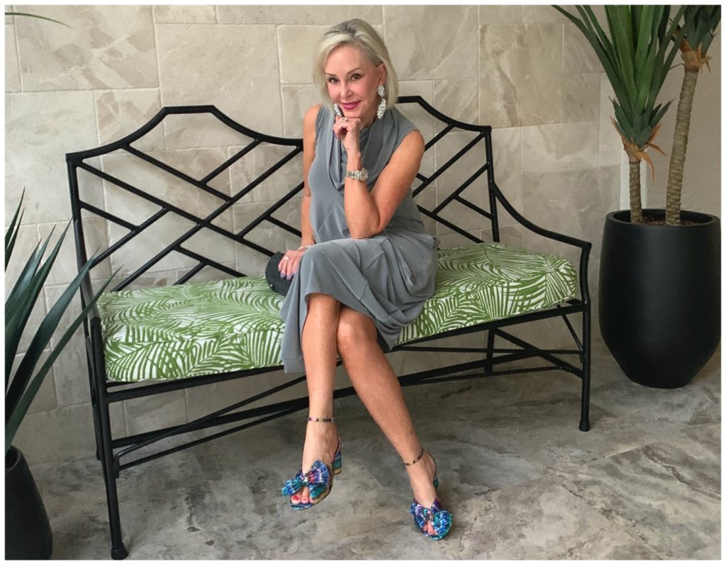 Sheree Frede sitting on a bench wearing a grey bubble dress