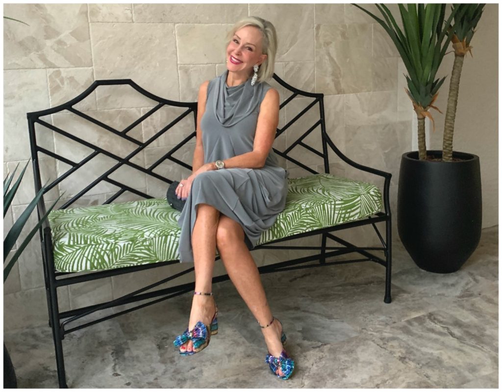 Sheree Frede sitting on a bench wearing a grey bubble dress