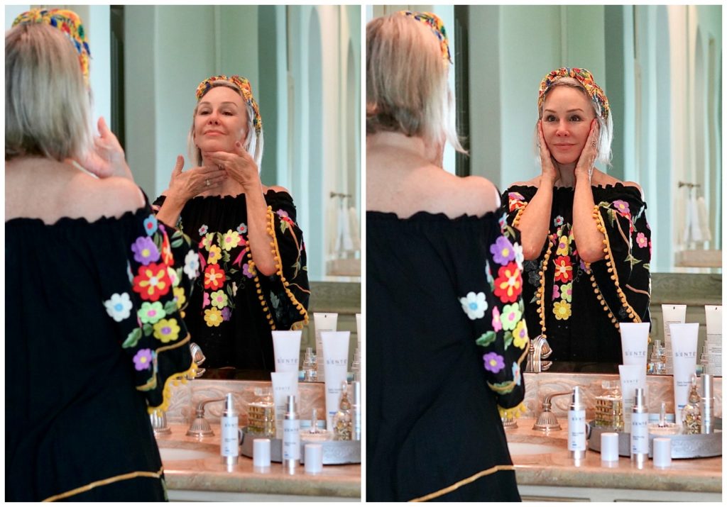Sheree Frede founder of the SheSheShow applying Sente skincare in her bathroom wearing a black floral offtheshoulder top