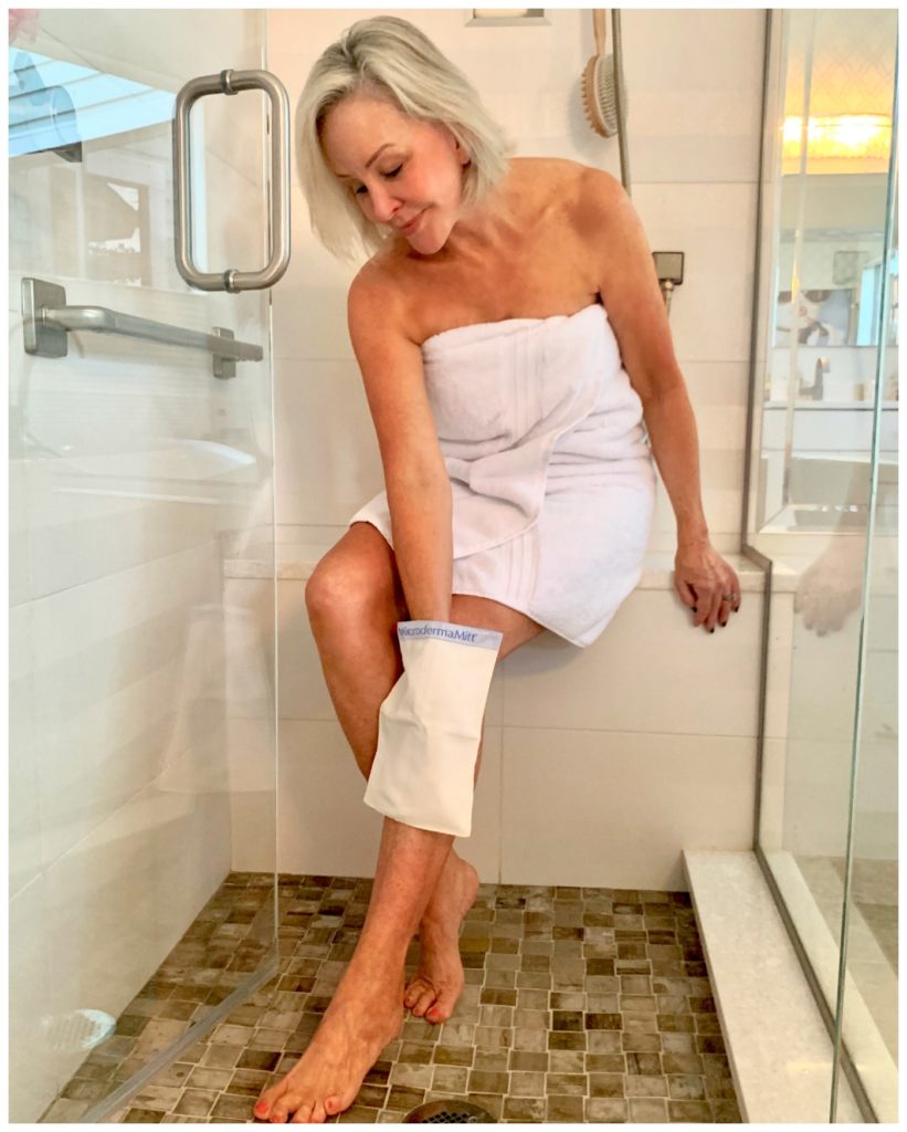 Sheree Frede of the SheShe Show in shower loofing legs with mit