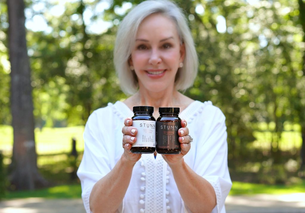 supplements wearing white top