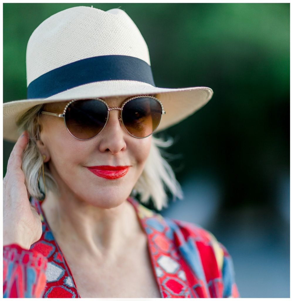 Sheree Frede of the SheShe Show wearing a fedora hat and sunglasses