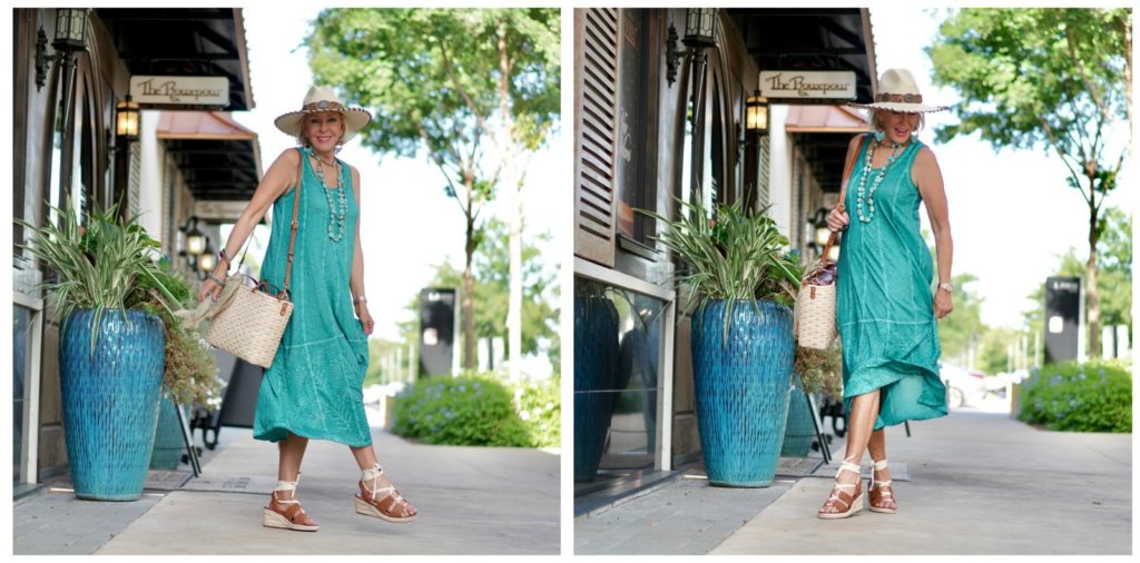 Sheree Frede of the SheShe Show walking down alley wearing green dress carrying straw toter