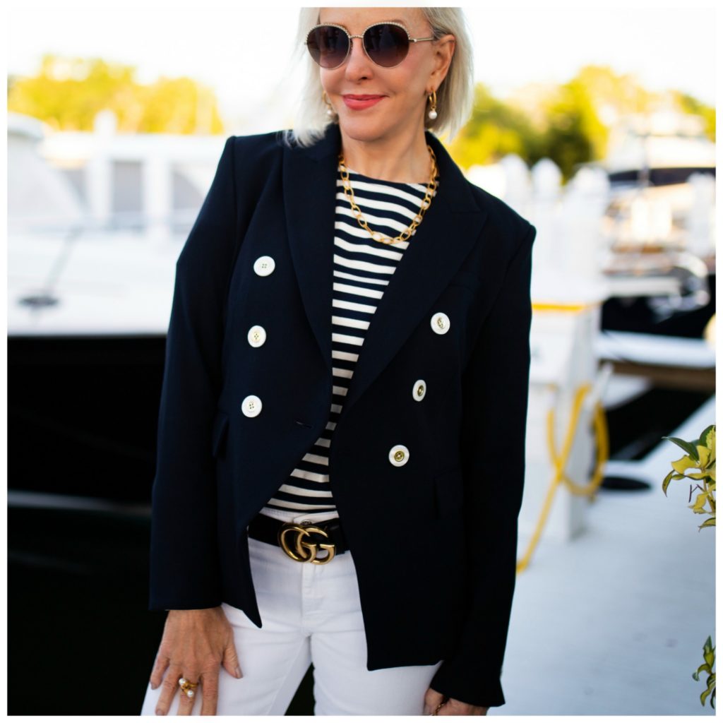 Sheree of the SheShe Show wearing navy blazer, stripe tee shirt and gold chain jewelry