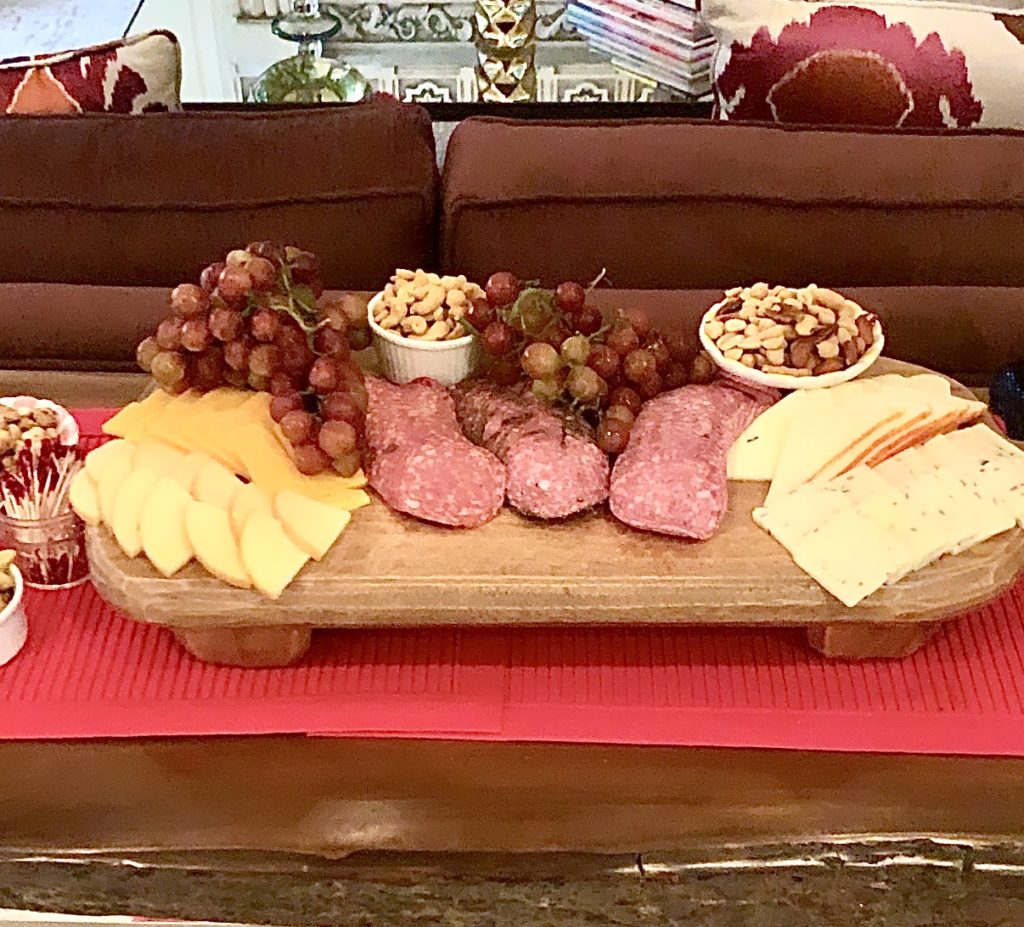 charcuterie board with cheeses and fruits