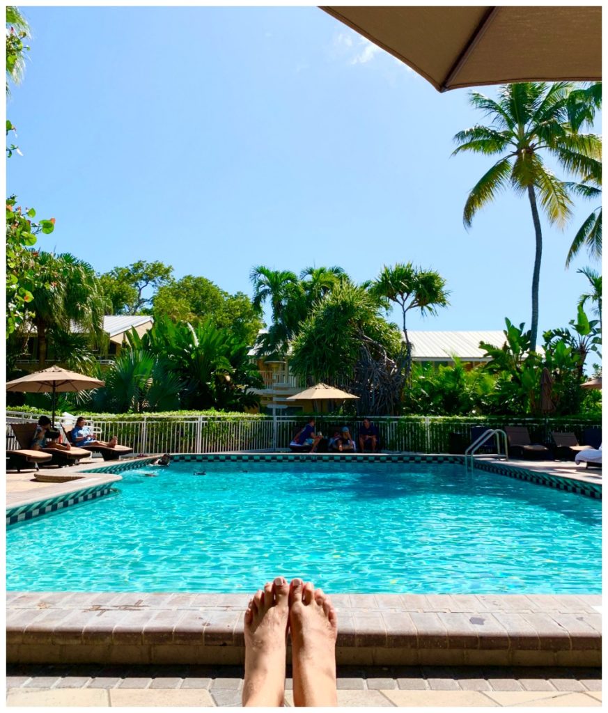 SheShe Show's feet with swimming pool in background