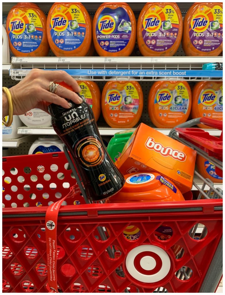Grocery cart at Target with hand placing Unstopables in shopping cart