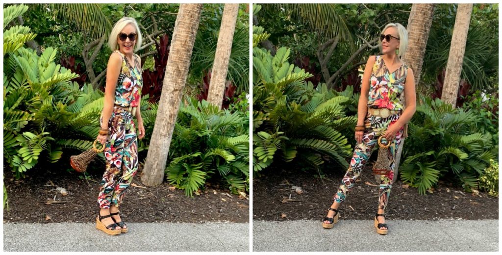 Sheree Frede of the SheShe Show standing in tropical foliage wearing a tropical pants outfit