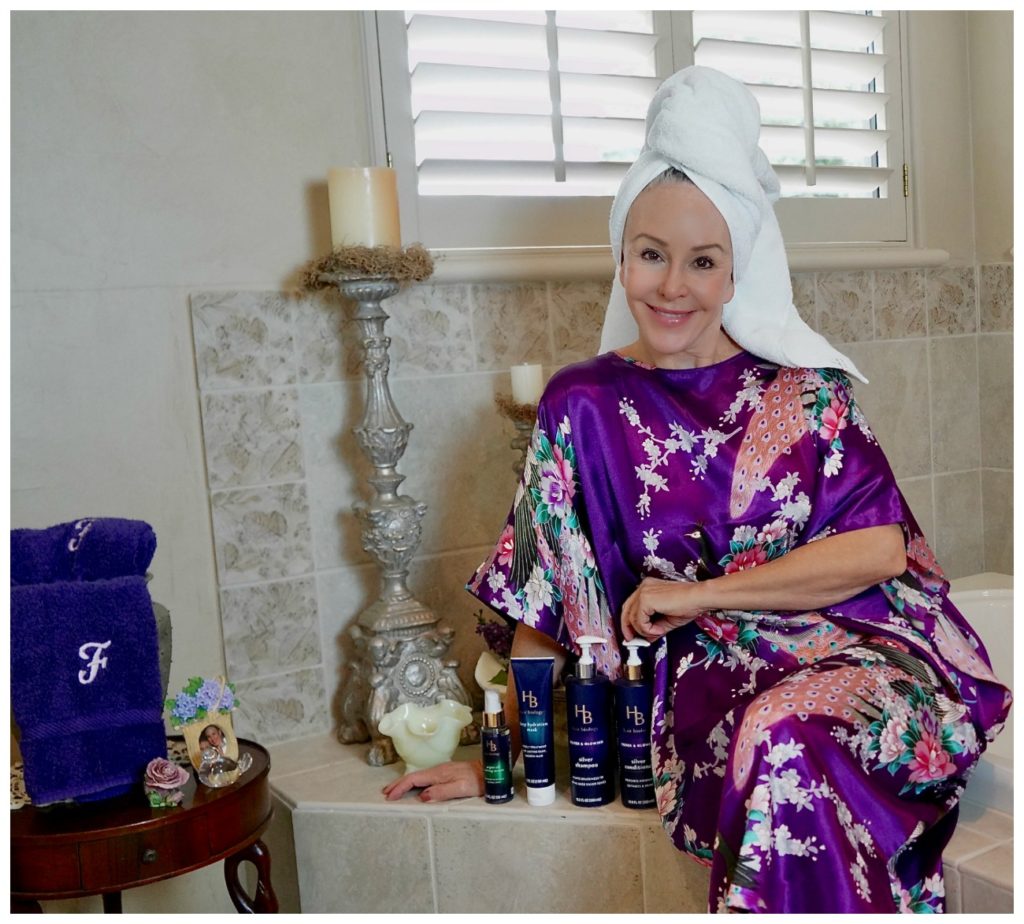 Sheree Frede with the SheShe SHow showing Hair Biology products wearing a purple kimono