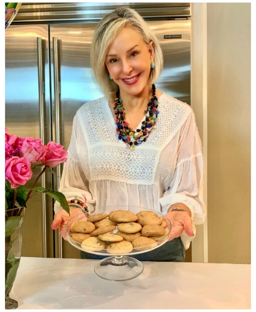 Sheree Frede of the SheShe SHow holding a plate of chocolate chip cookies