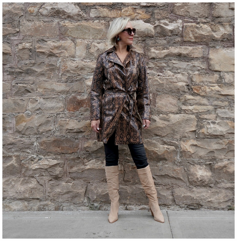 Sheree Frede of the SheShe Show wearing a snakeskin print faux leather trench coat